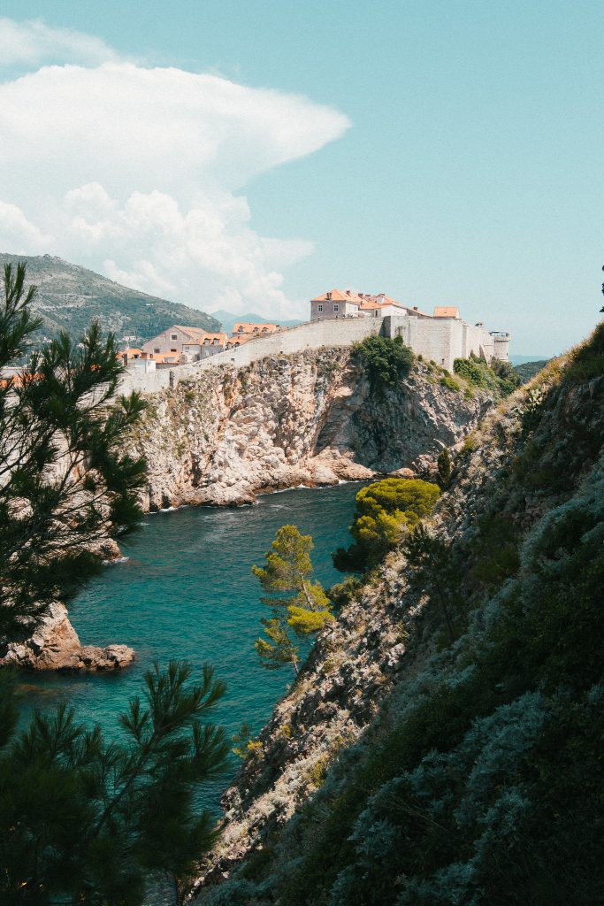 Cliffside town overlooking a bright blue cove