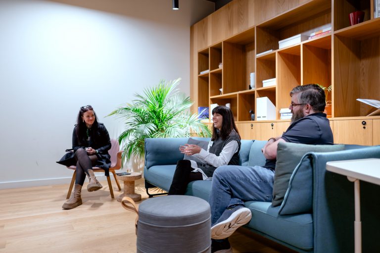 Small group having a relaxed conversation in a lounge