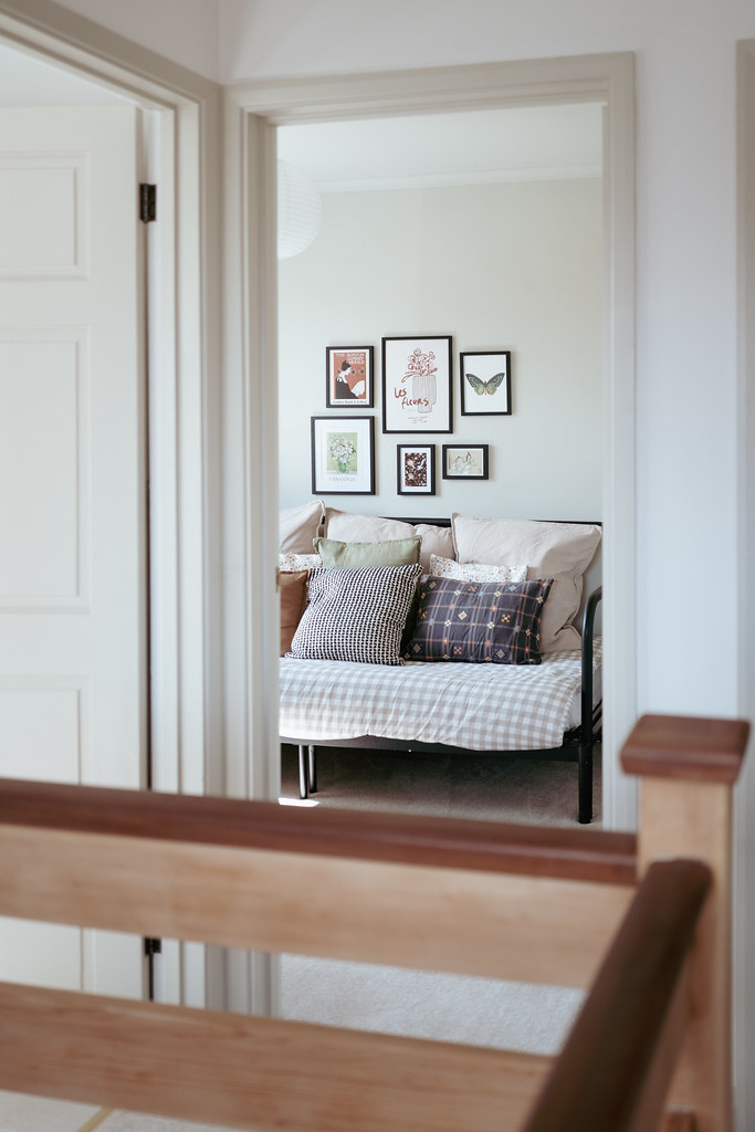 Landing view through to a softly styled bedroom