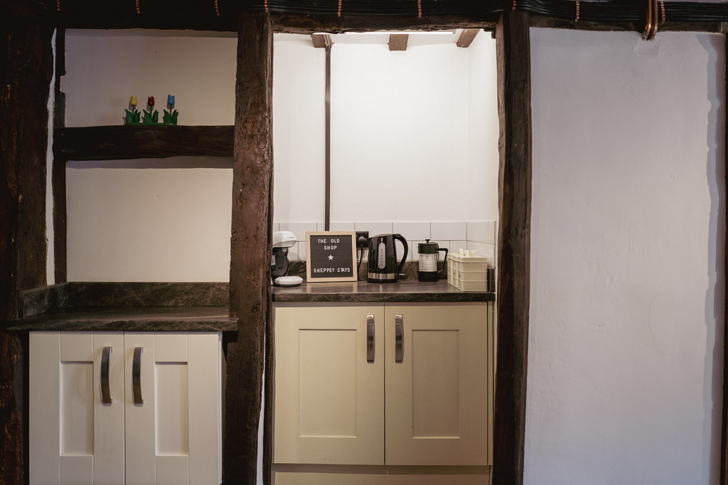 Small kitchenette set between exposed timber beams